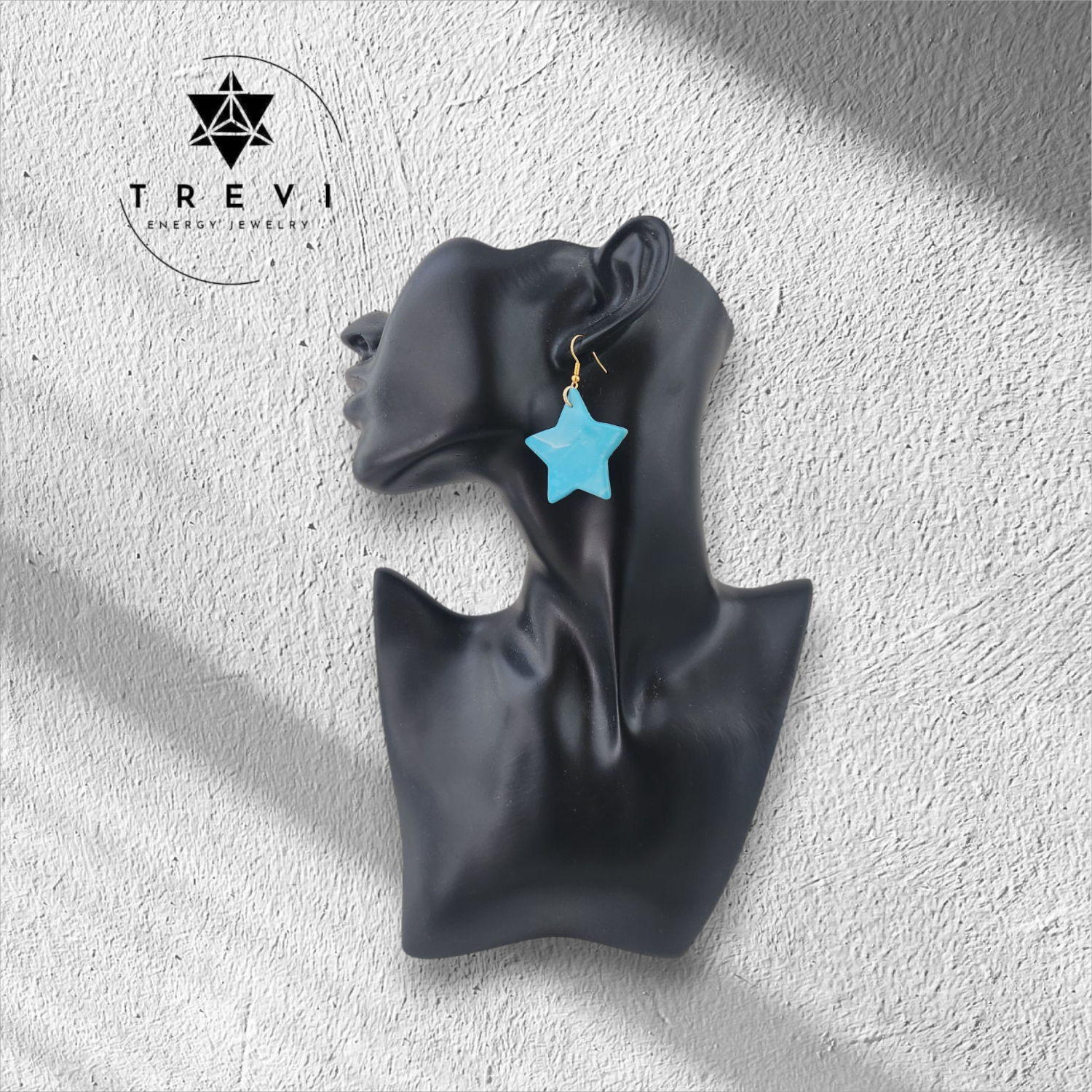 A blue star-shaped earring.