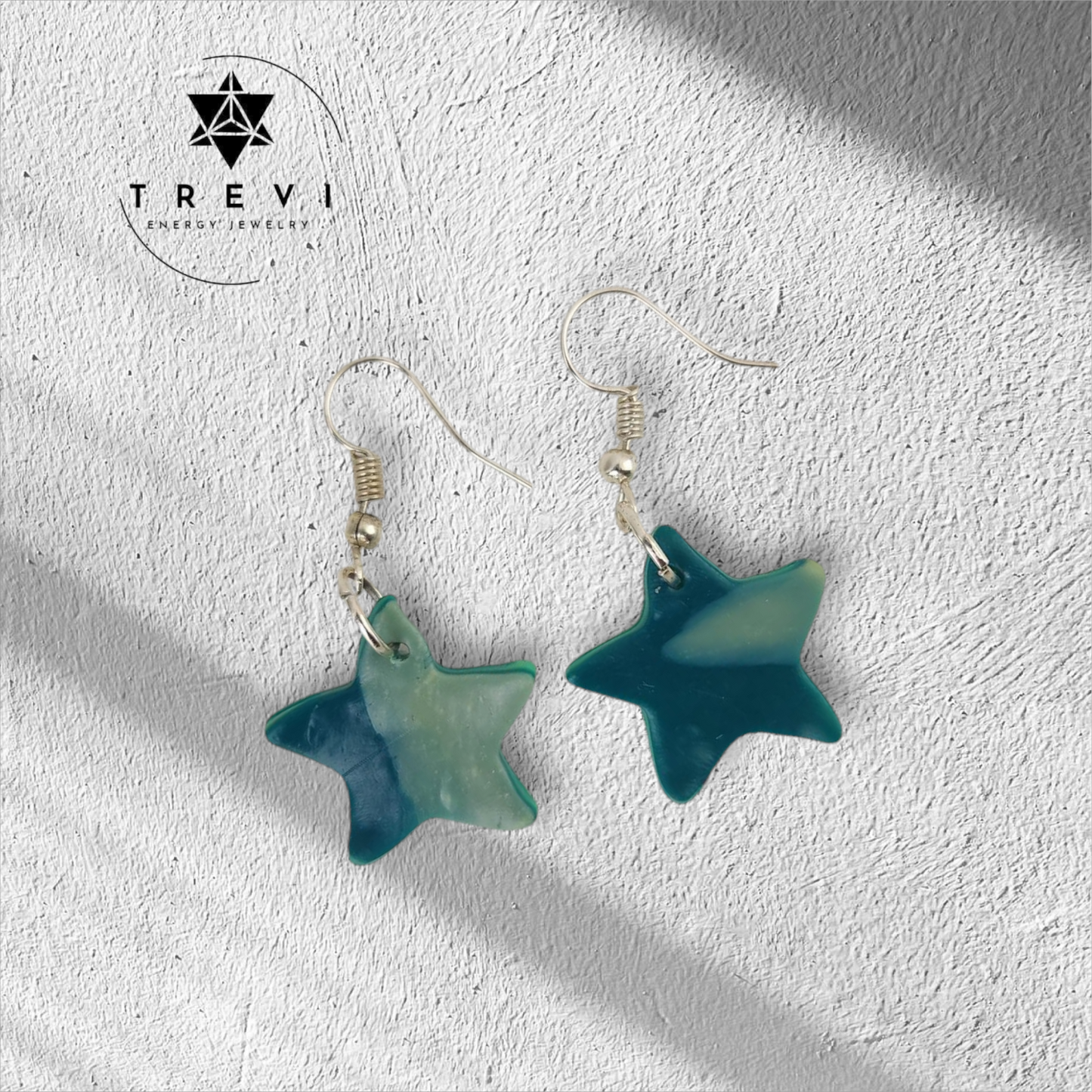 A pair of blue and white star-shaped earrings.