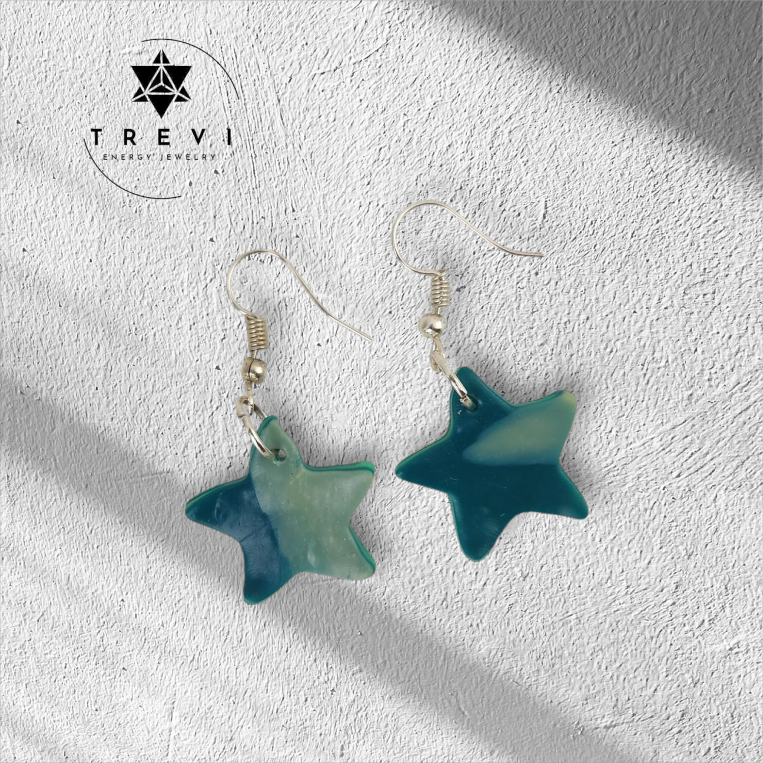 A pair of blue and white star-shaped earrings.
