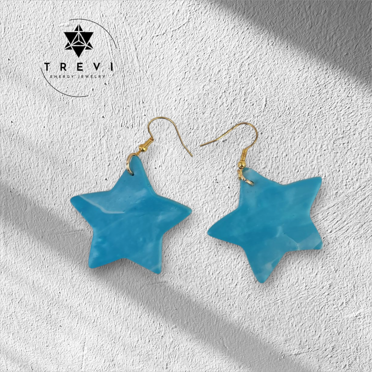 A pair of celeste star-shaped earrings.