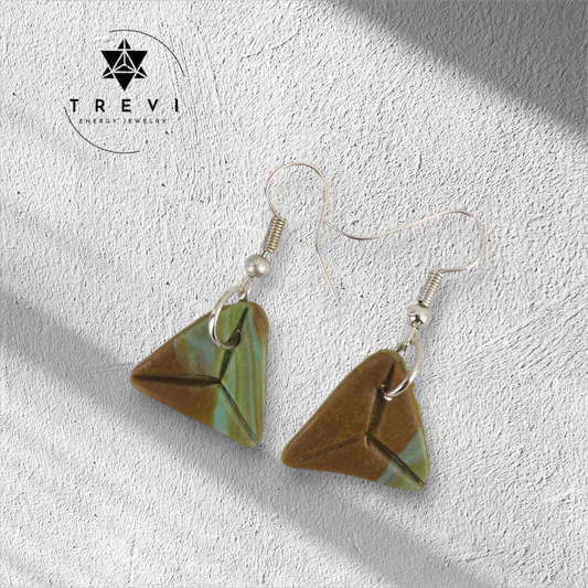A pair of drop earrings with a geometric pattern in brown and green colors.