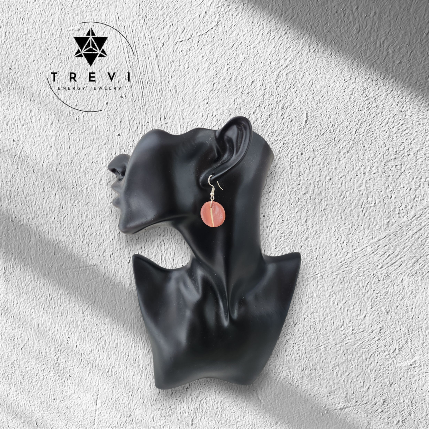 A small pink circle earrings.