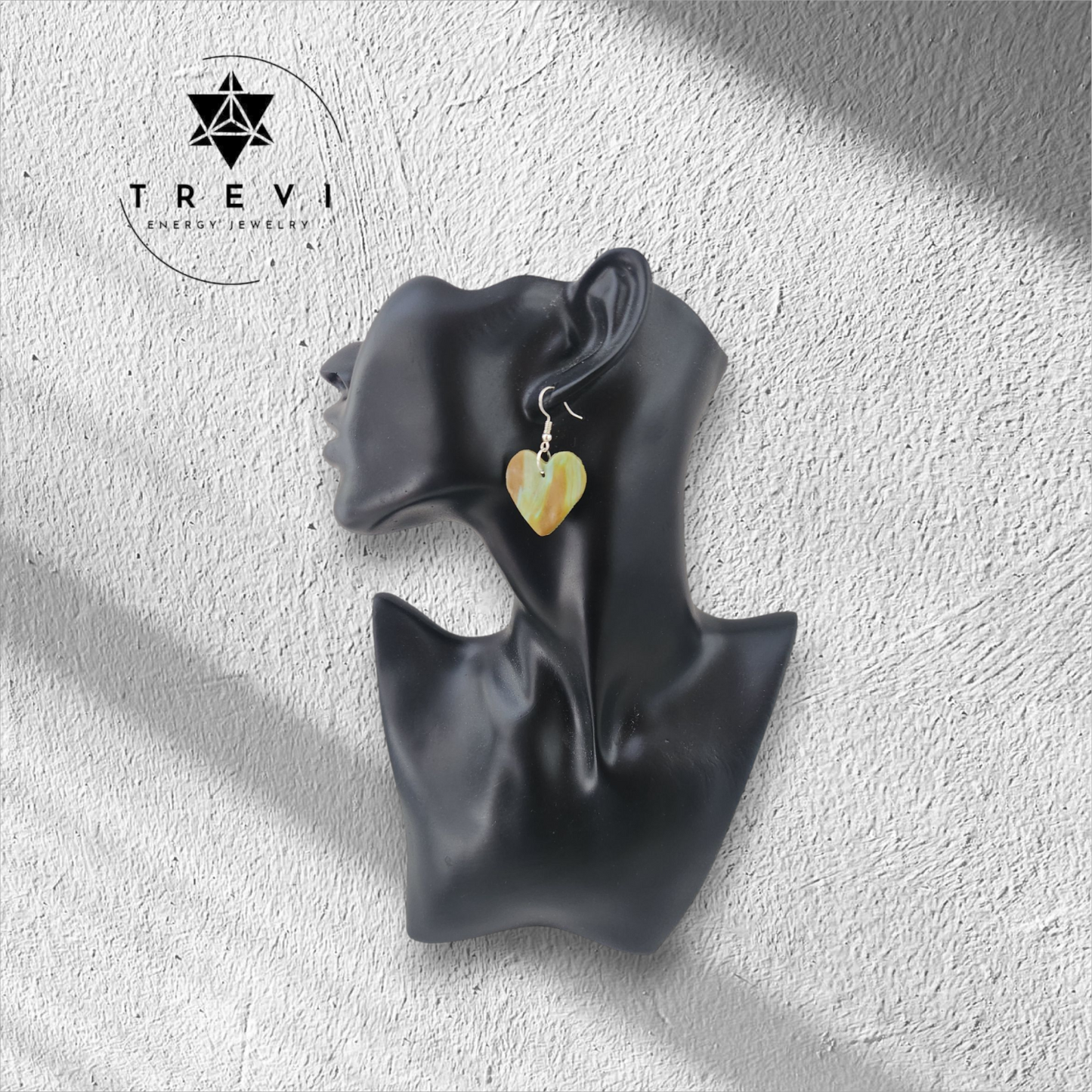 Heart-shaped brown and green earring.