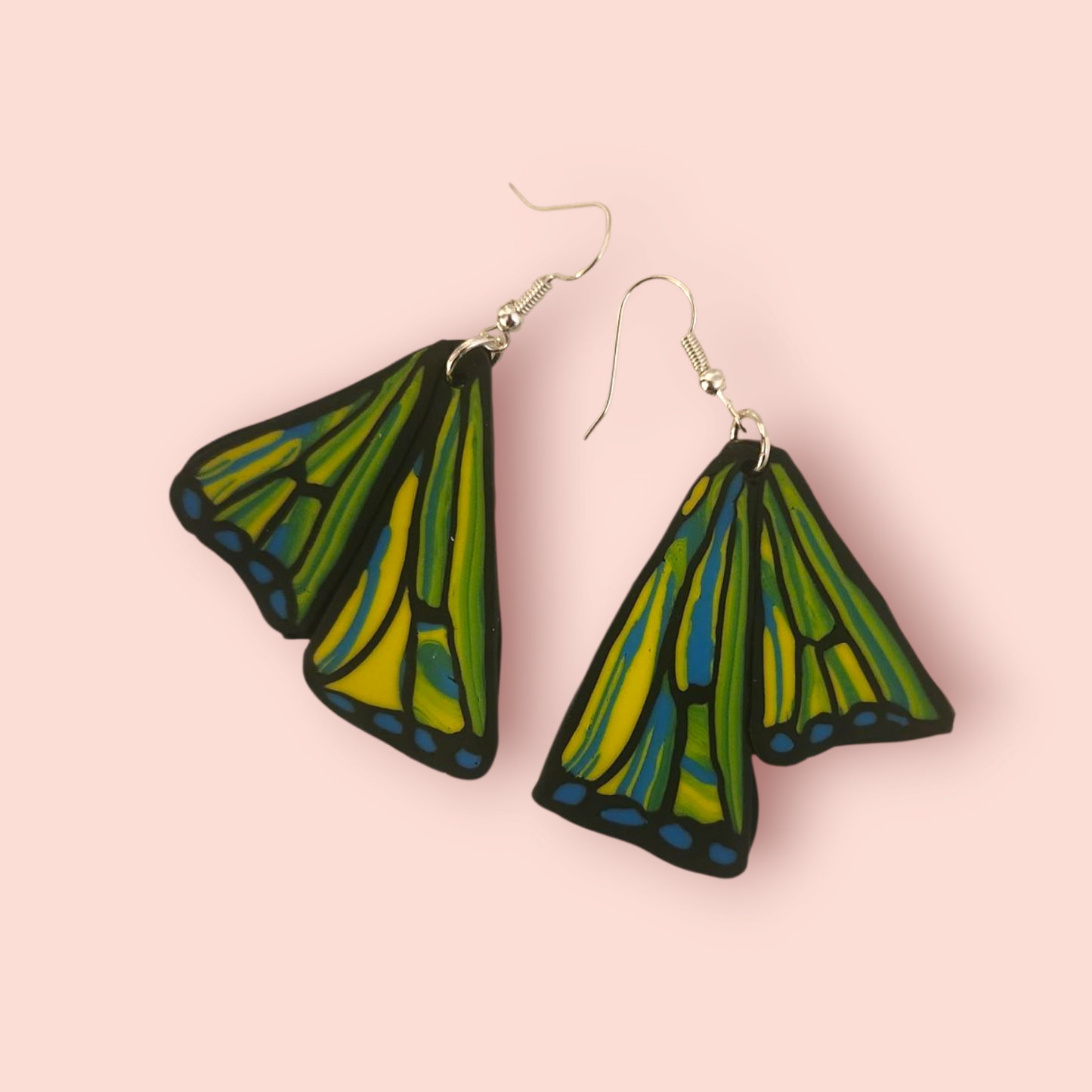Pair of green and blue wing-shaped earrings 