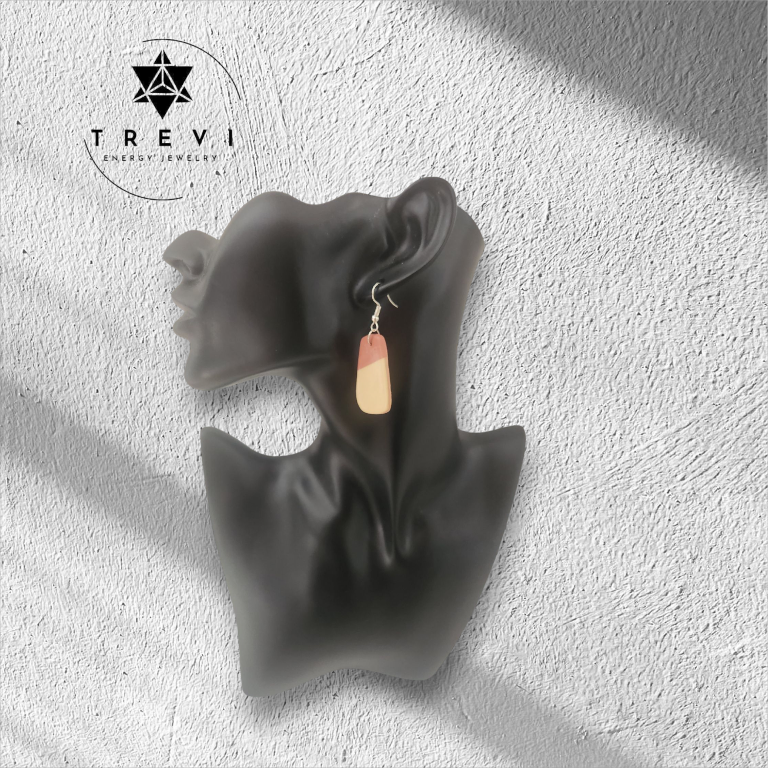 Rounded rectangular statement earring with light pink and cream color