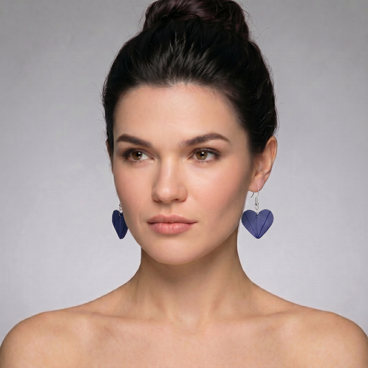 blue heart energy earrings worn by model spiritual handmade jewelry.