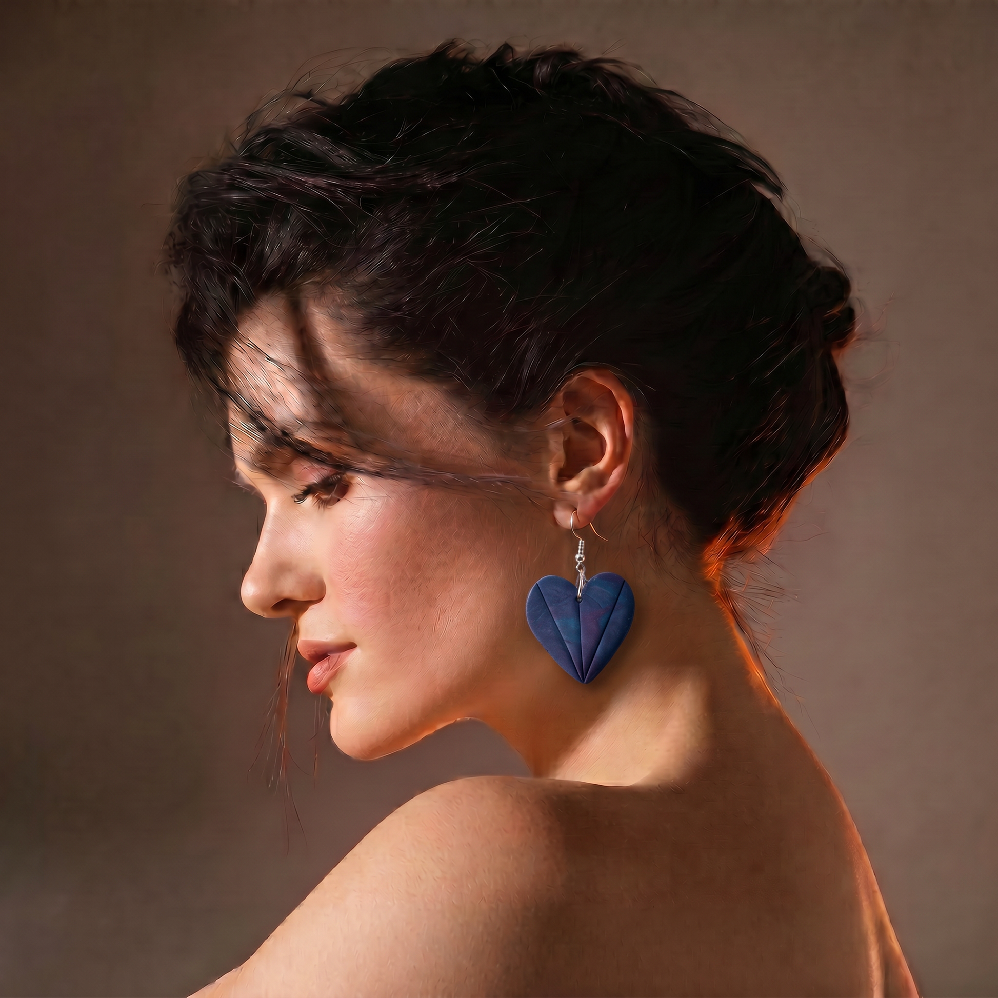 Navy blue heart energy earrings worn by model spiritual handmade jewelry
