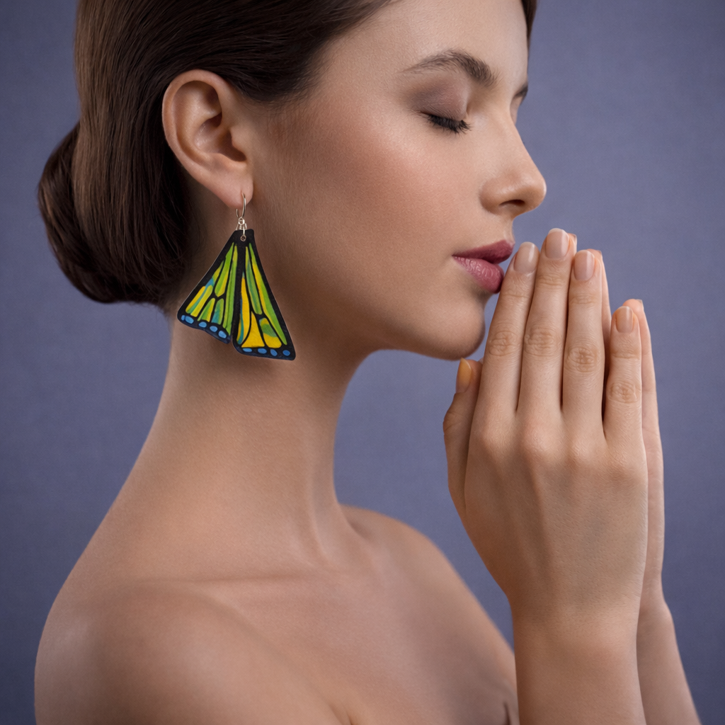 Model wearing monarch butterfly earrings transformation style