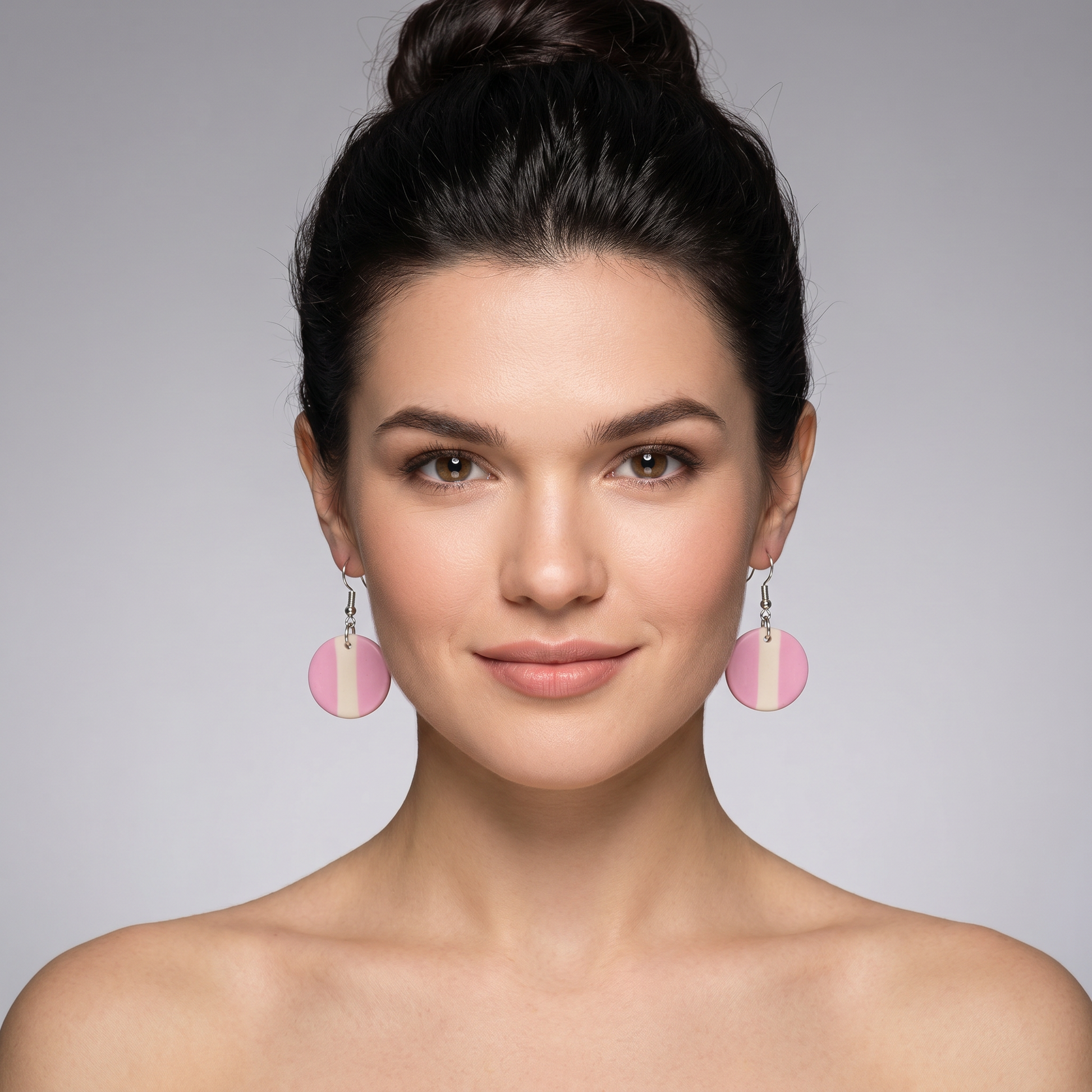 woman wearing circle life earrings pink handmade jewelry.