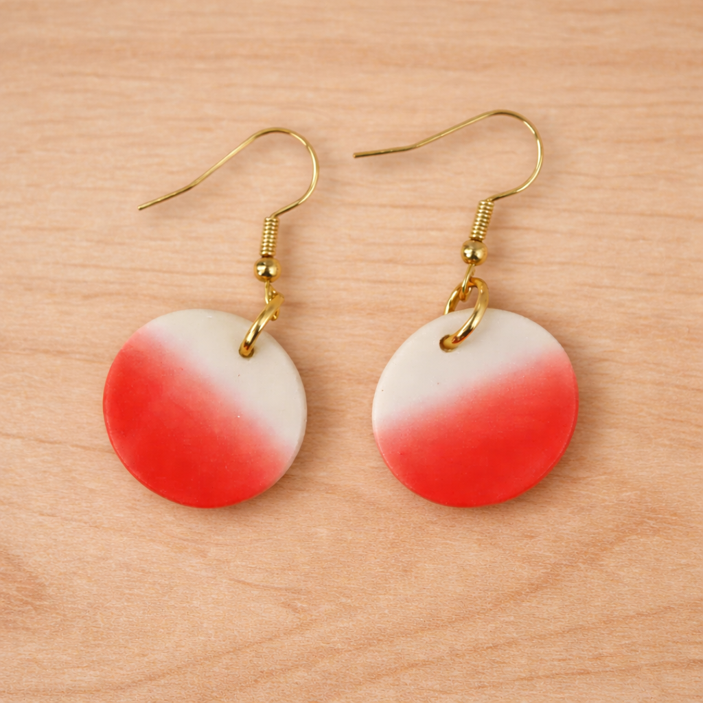 circle life earrings handmade pink and white on wood background