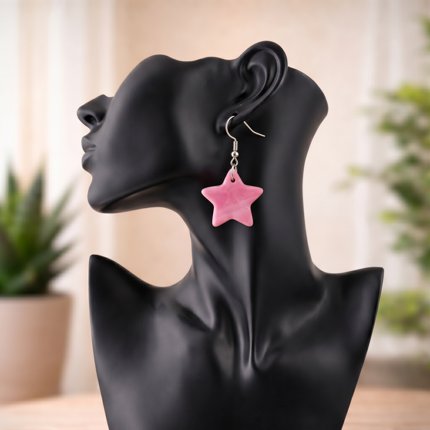 star earrings sacred geometry pink earrings on mannequin
